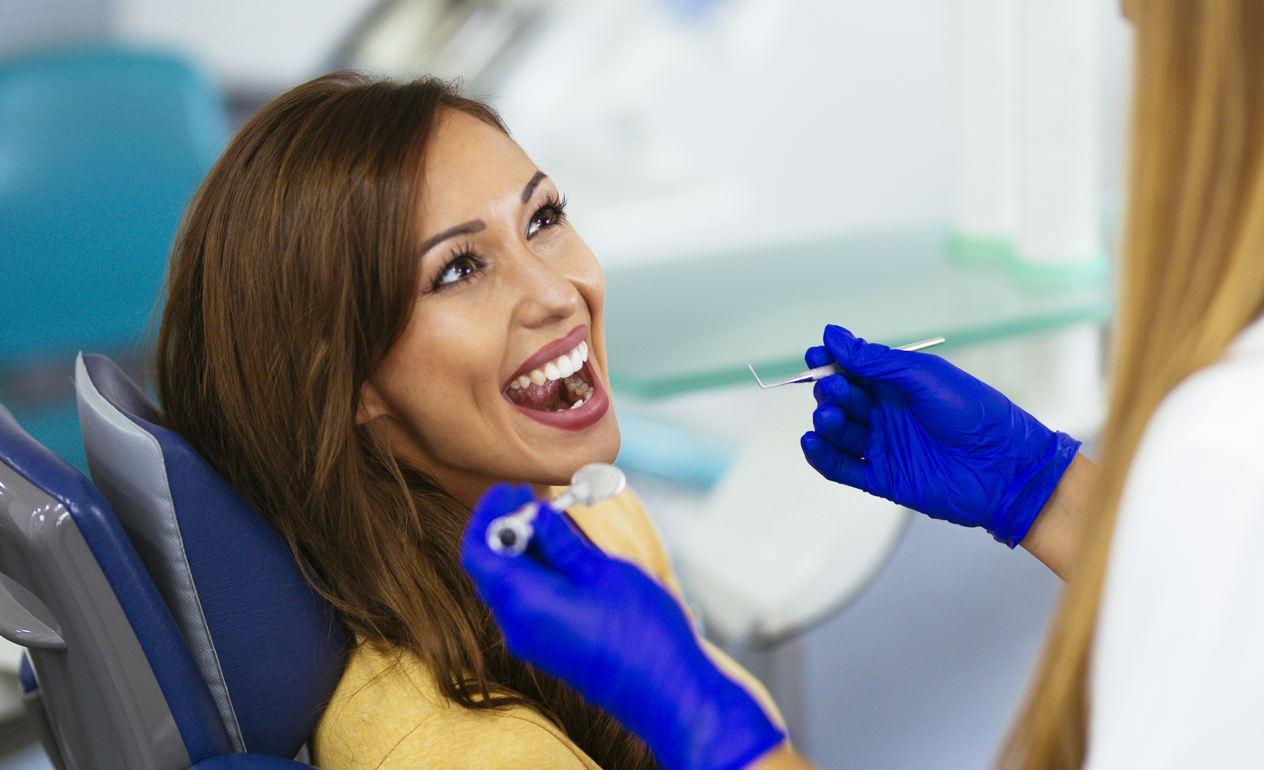 Happy patient at the dentist - stock photo