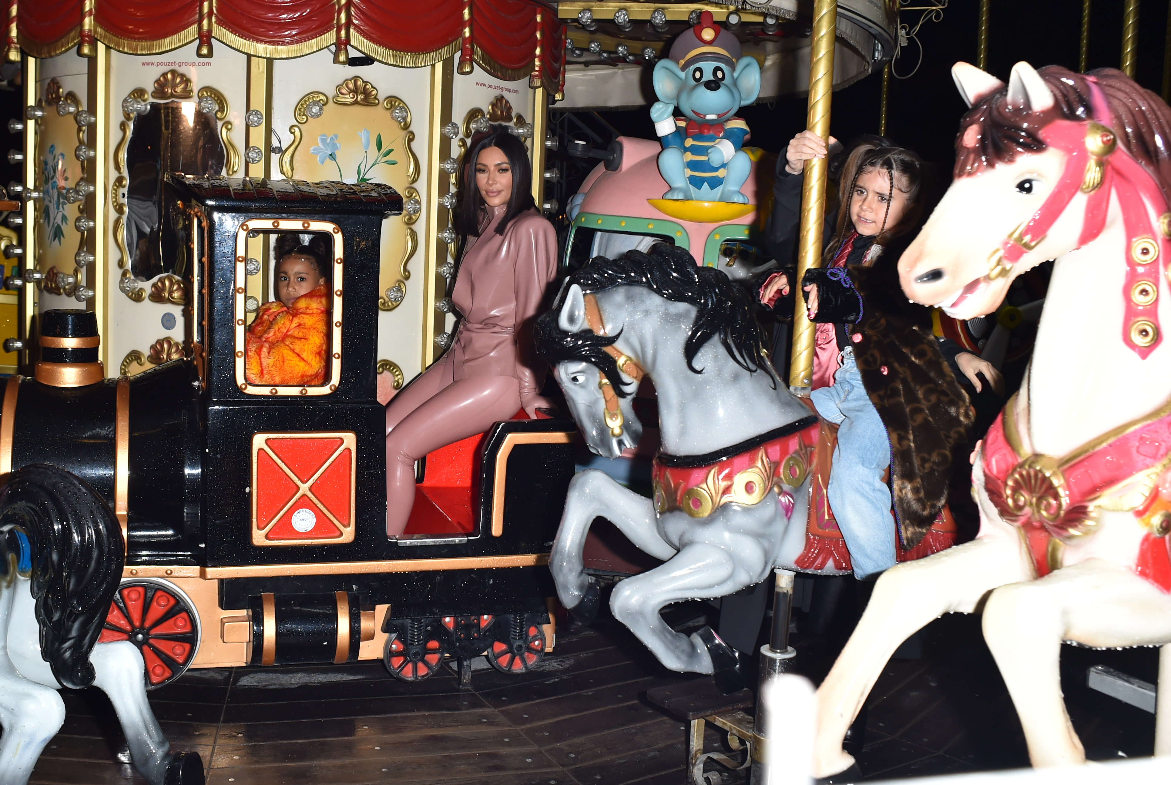 Kim Kardashian West and Kourtney Kardashian ride Eiffel Tower carousel with daughters North West and Penelope Disick