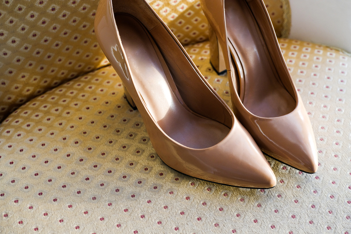 Designer Wedding Beige Patent Leather Shoes Of The Bride On An Expensive Velour Chair. Women's New Modern Fashion High-Heeled Shoes, Genuine Leather. Morning Preparations For The Wedding.
