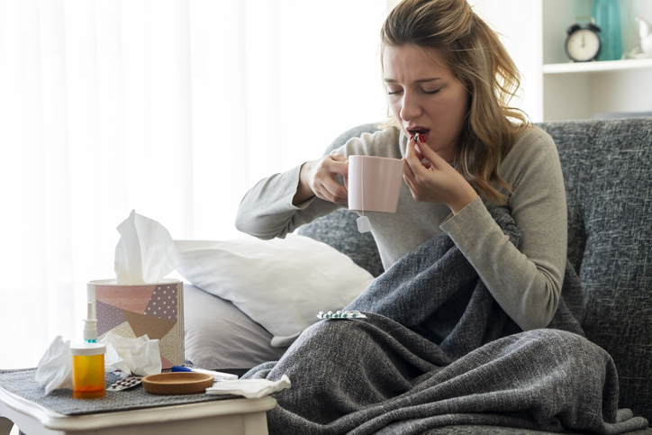 Sick woman with flu at home