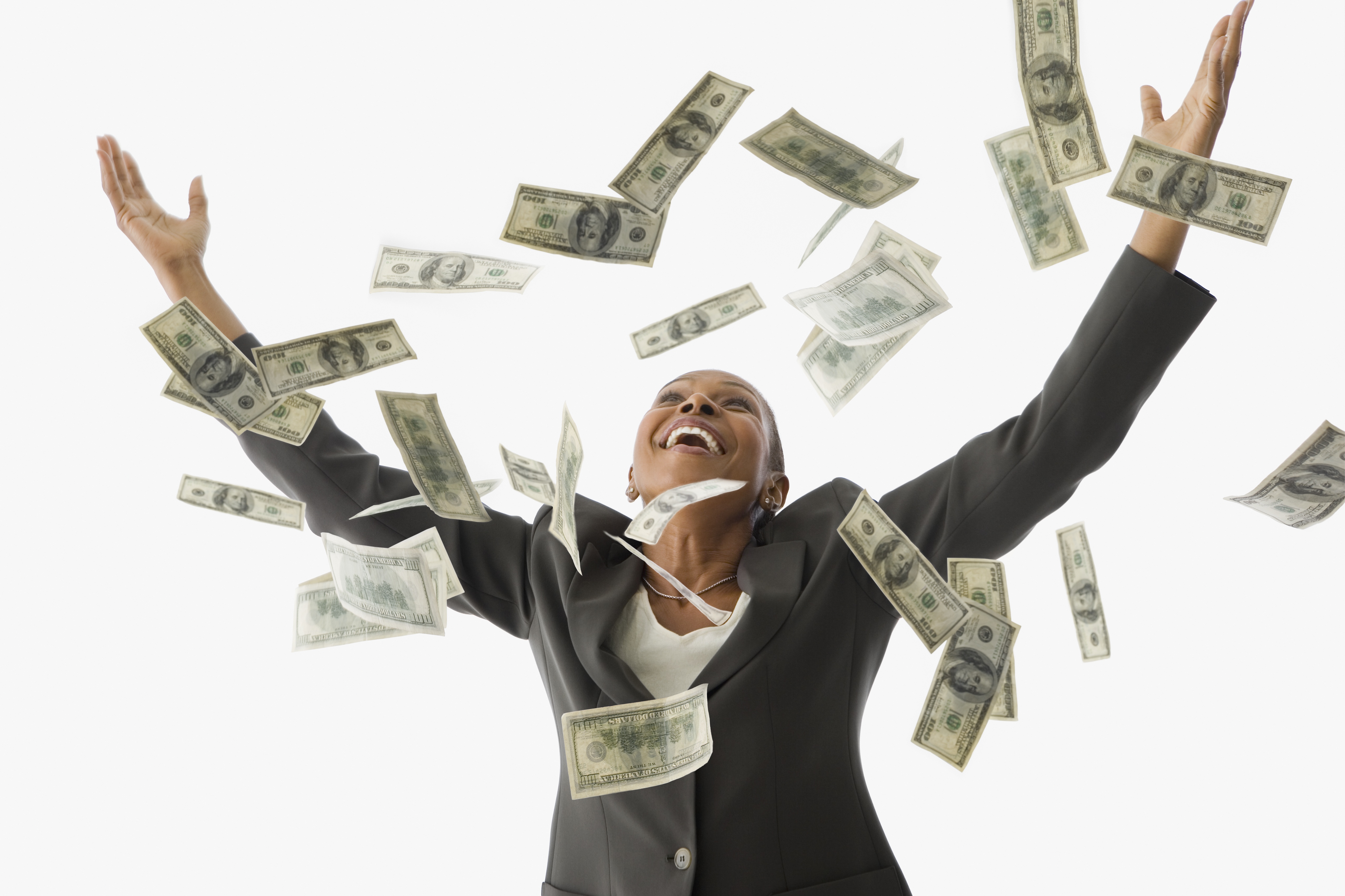 African American businesswoman throwing money in the air - stock photo