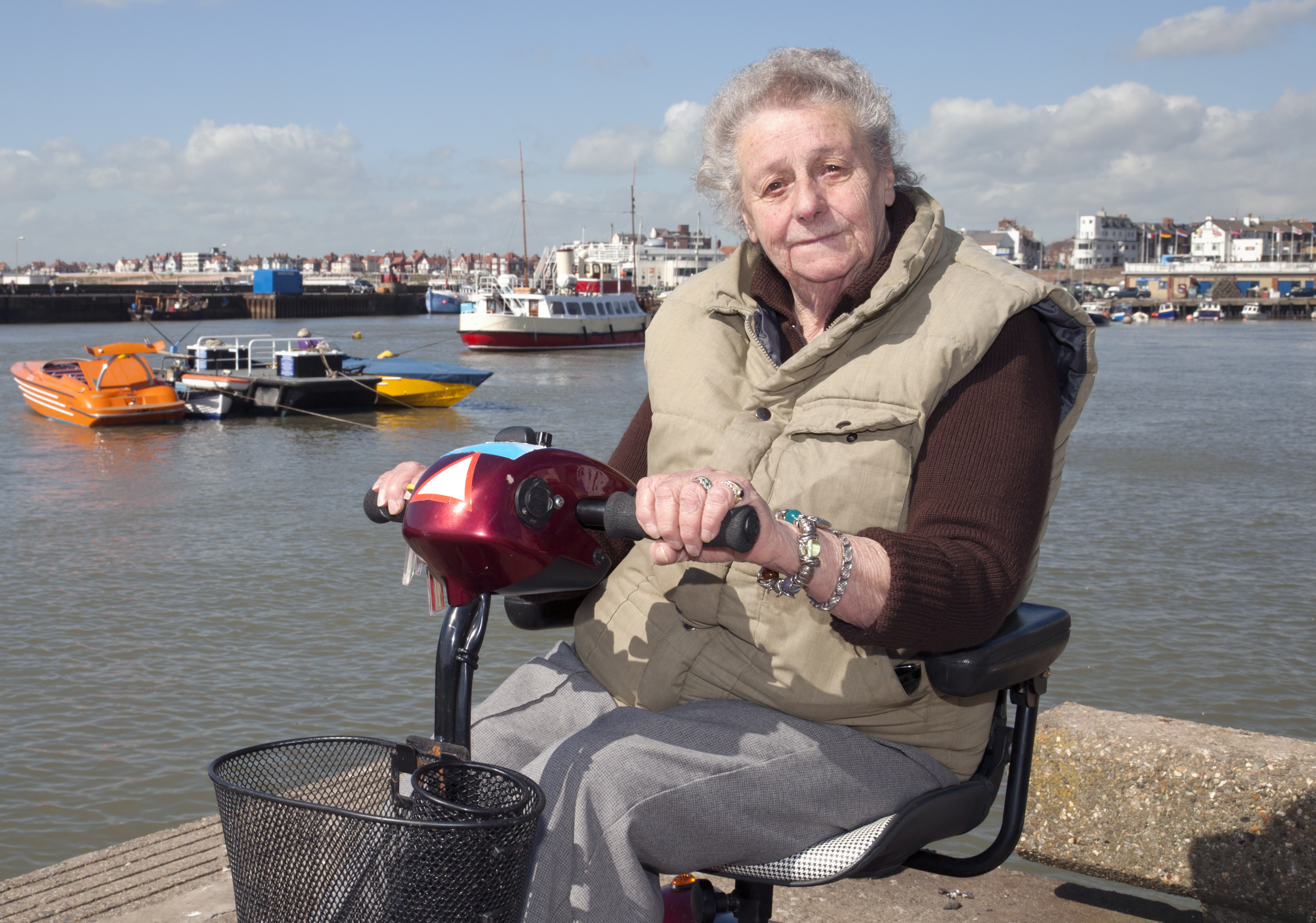 Elderly Lady on Mobility Scooter - stock photo