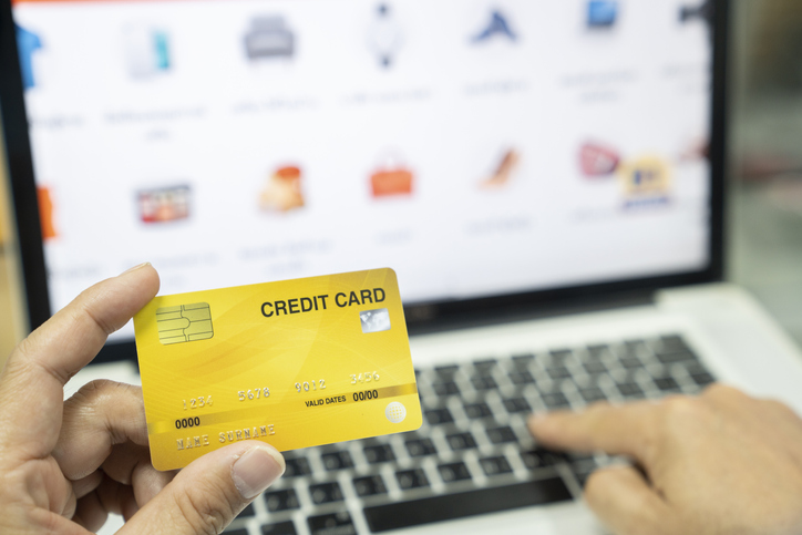 man using credit card for online shoping