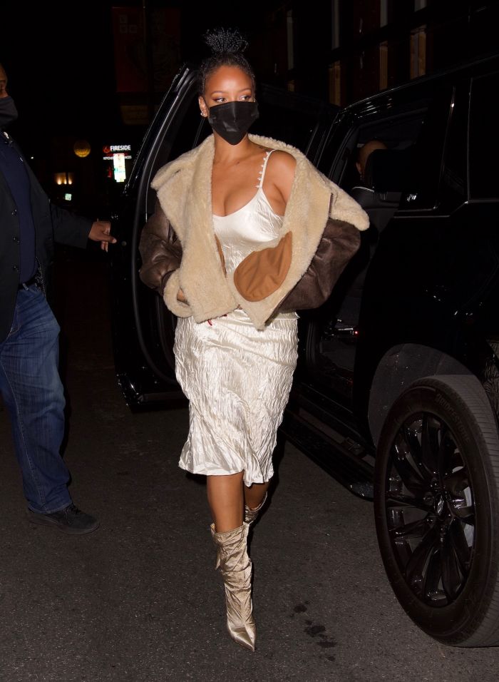 Rihanna wore a cream colored slip dress and natural colored booties for dinner out in Los Angeles