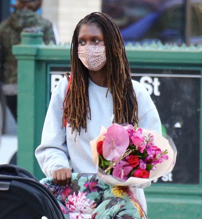 Jodie Turner-Smith walking daughter Janie Jackson in a stroller in Soho