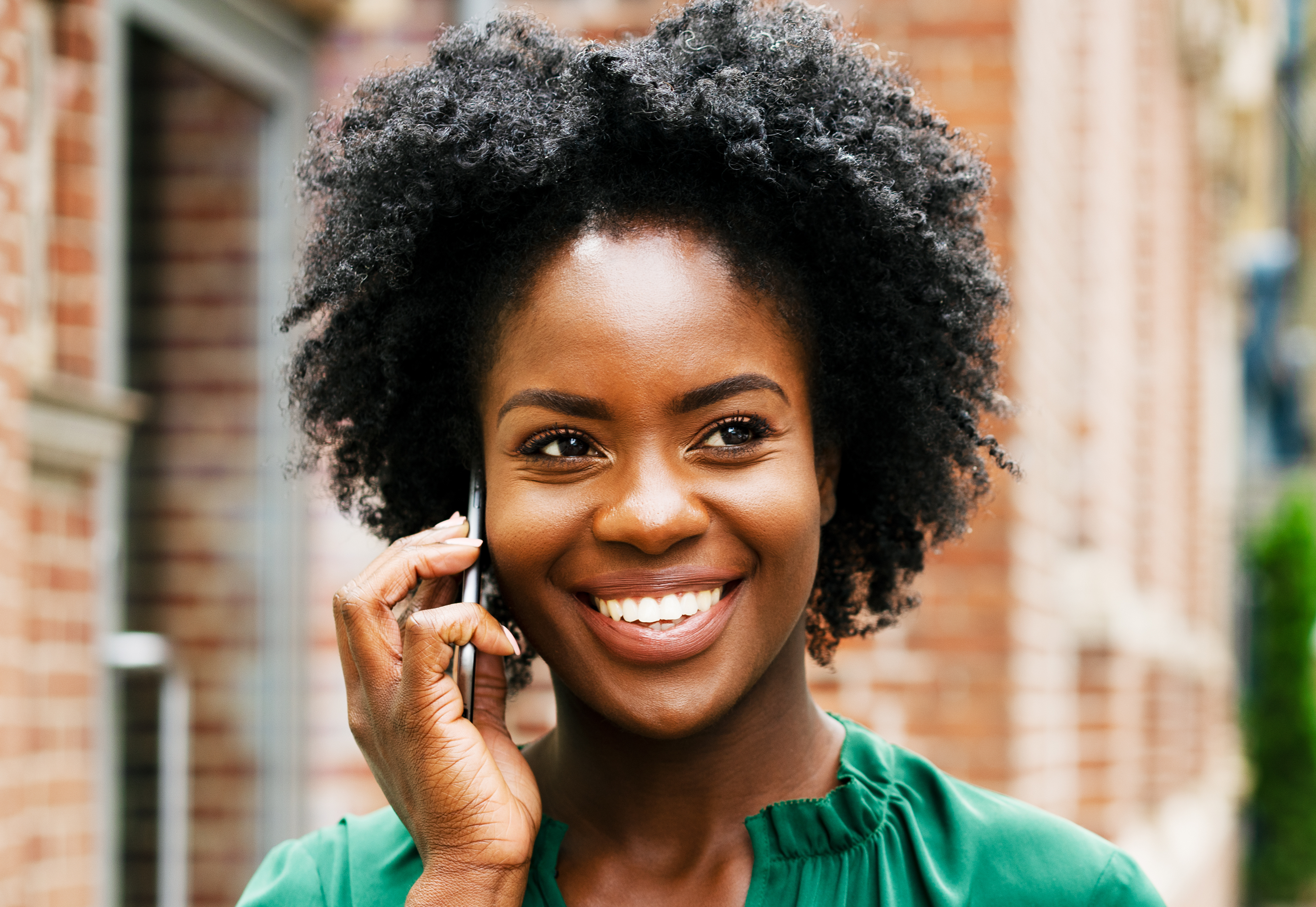 Woman on smart phone, smiling - stock photo