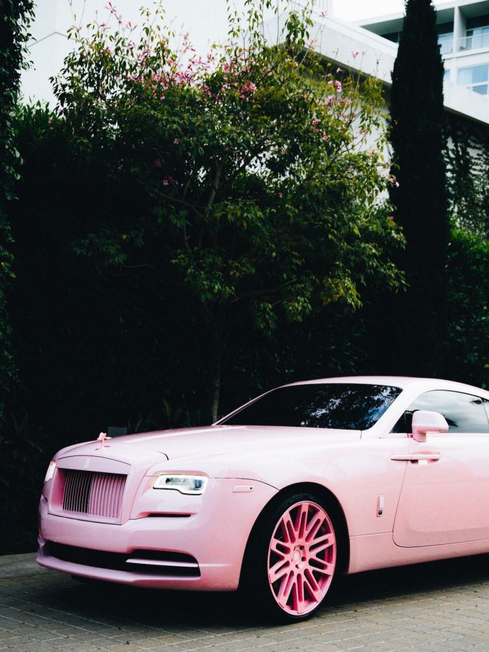 Shannade and Shannon Clermont wear blue jumpsuits pink Rolls Royce