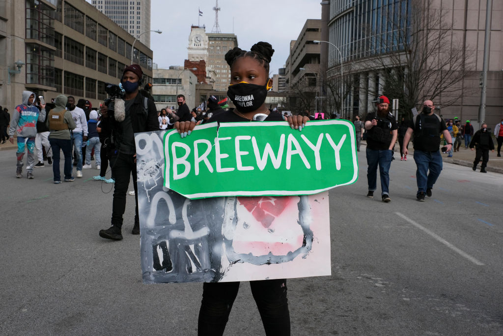 A supporter holds a sign reading Breewayy during a rally