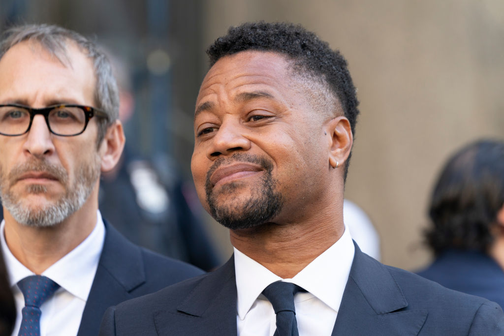 Actor Cuba Gooding Jr. listens as attorney Mark Heller...