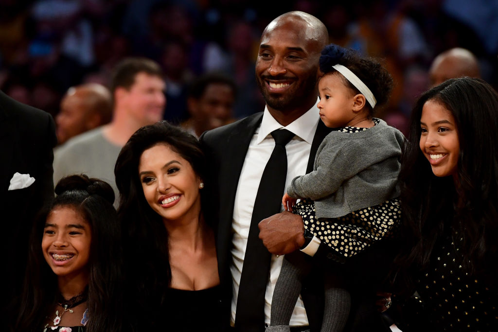 Kobe Bryant poses with his family