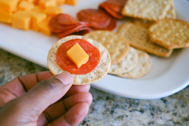 Woman Eats Salty Snacks