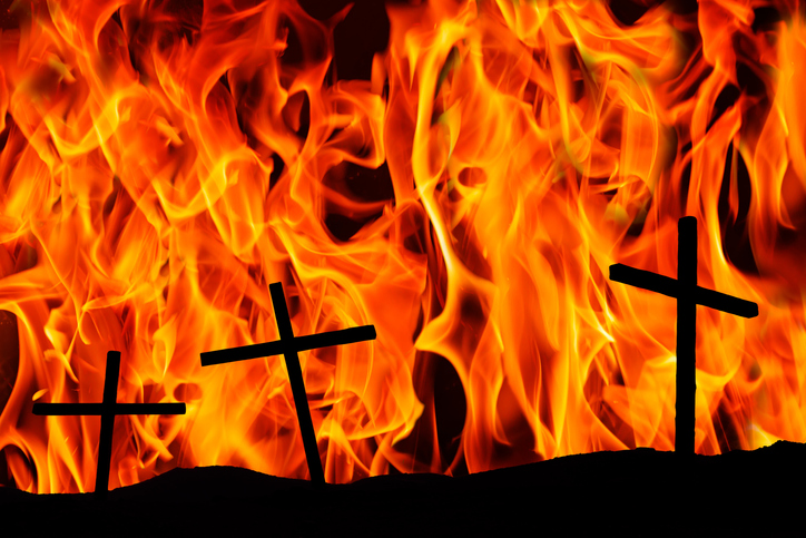 Three christian crosses on the background of the flame. Religion concept