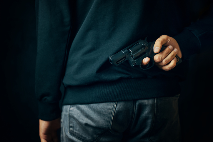 Midsection Of Man Holding Smart Phone