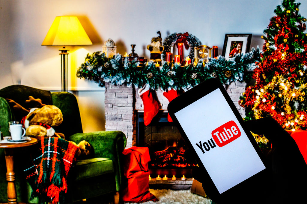 In this photo illustration a Youtube logo seen displayed on...