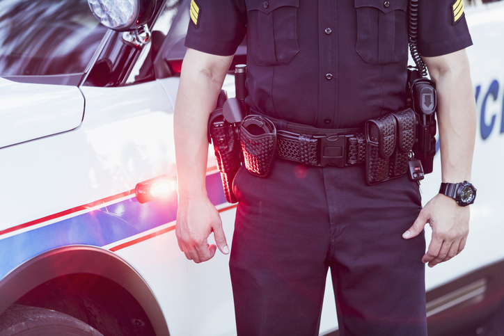 Cropped view of police officer's belt