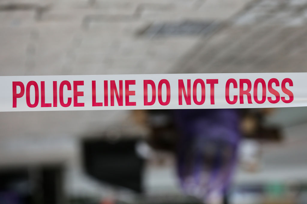 A police tape around a crime scene...