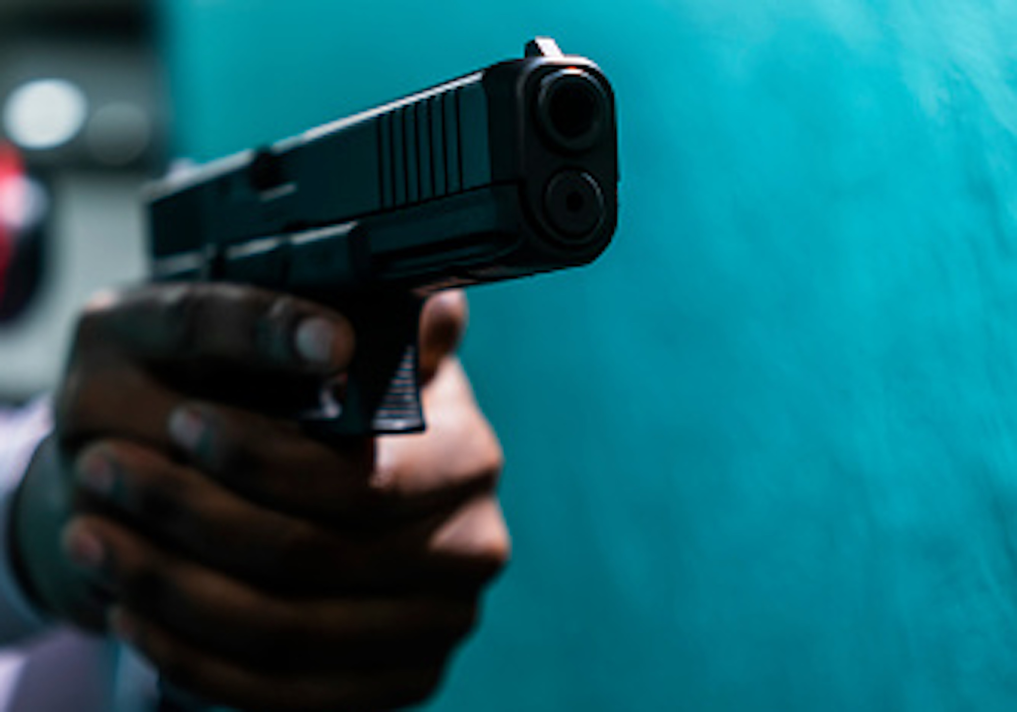 Black woman shooting gun