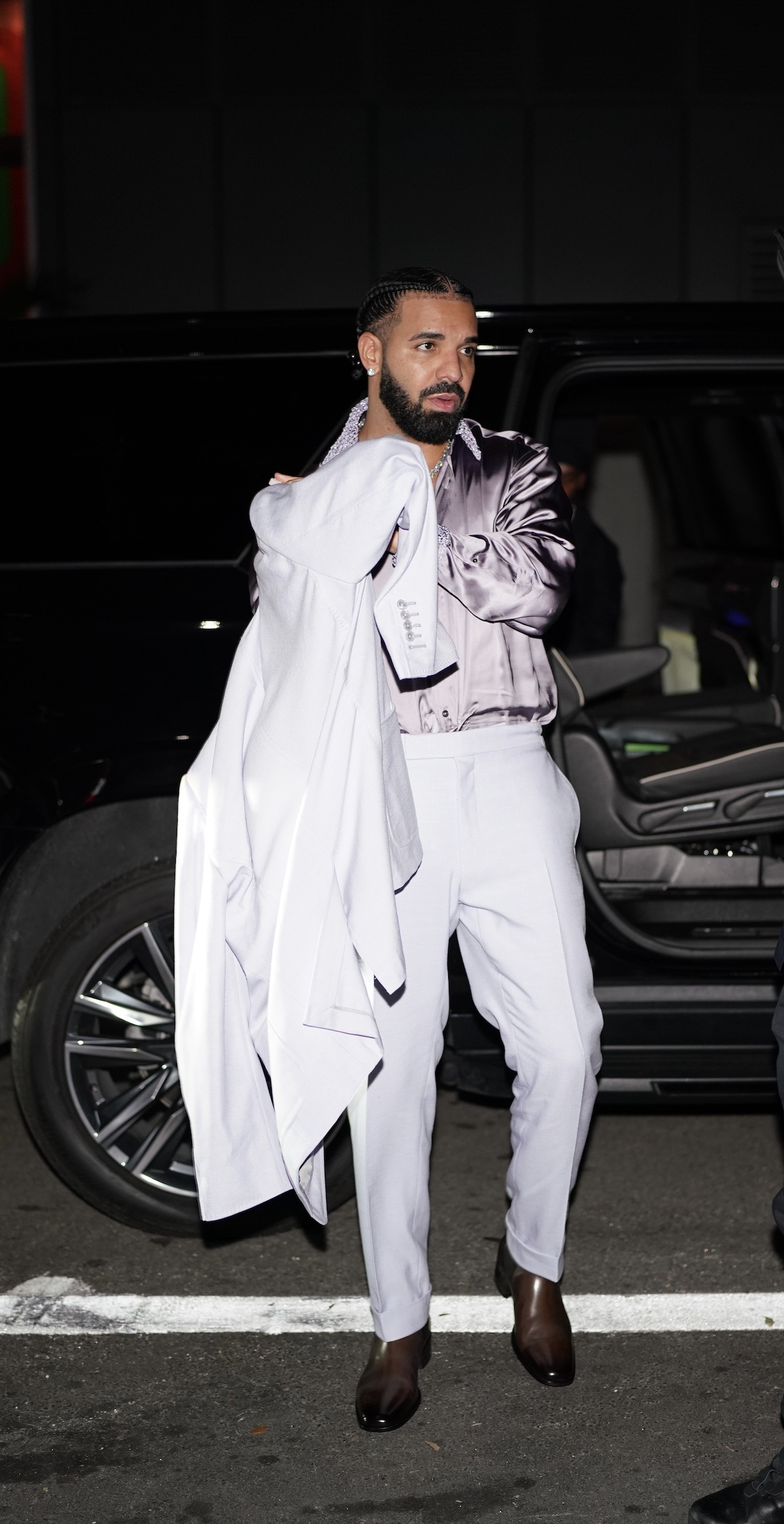 Drake wears lavender suit for birthday party at Sexy Fish