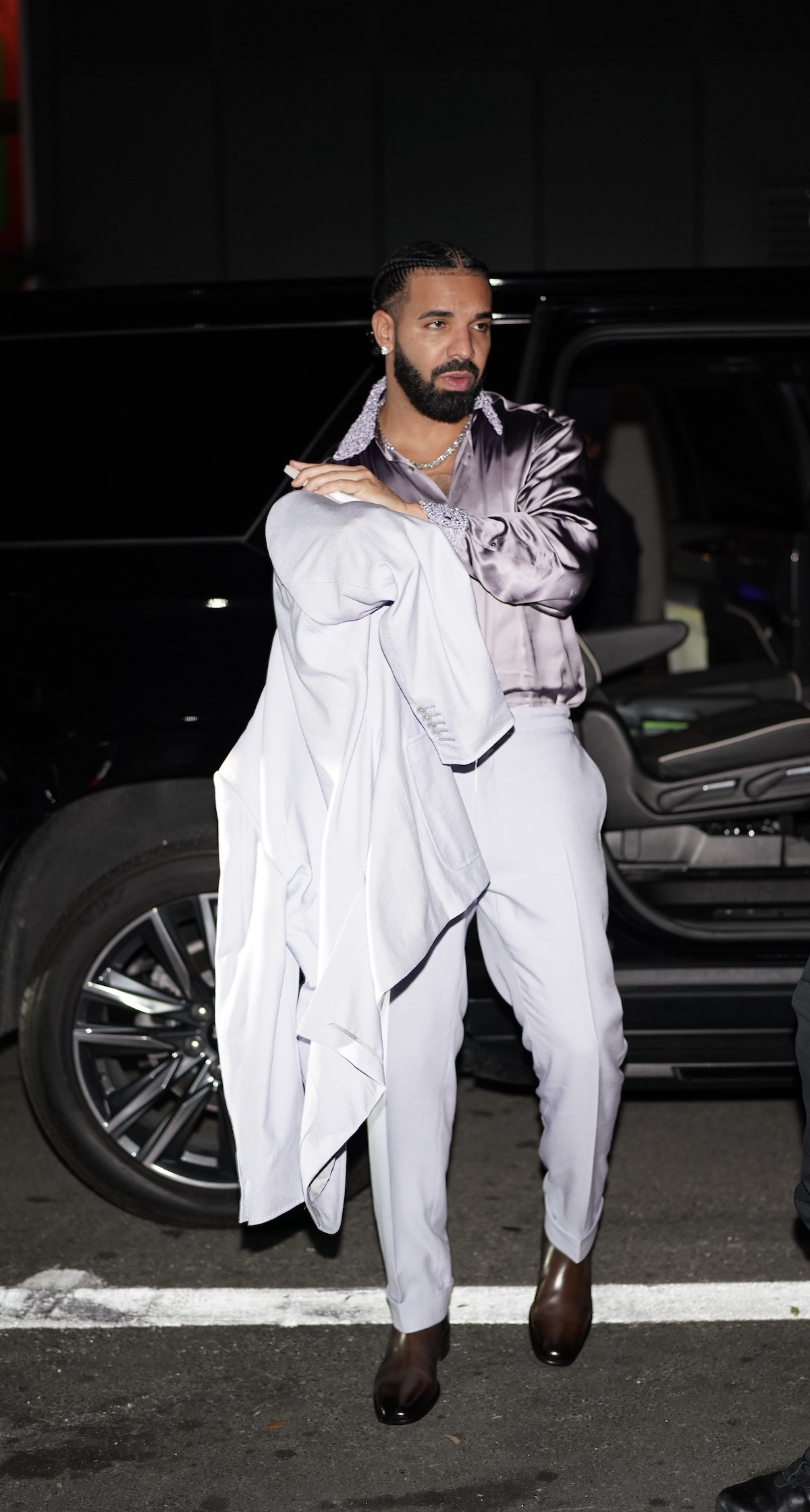Drake wears lavender suit for birthday party at Sexy Fish
