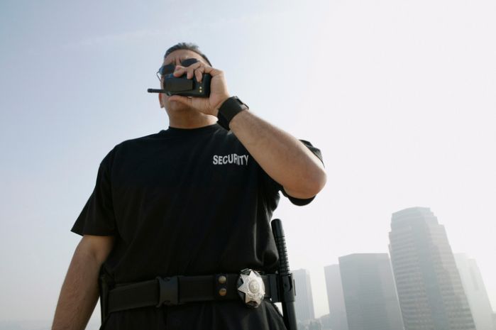 Security Guard Talking on Walkie-talkie