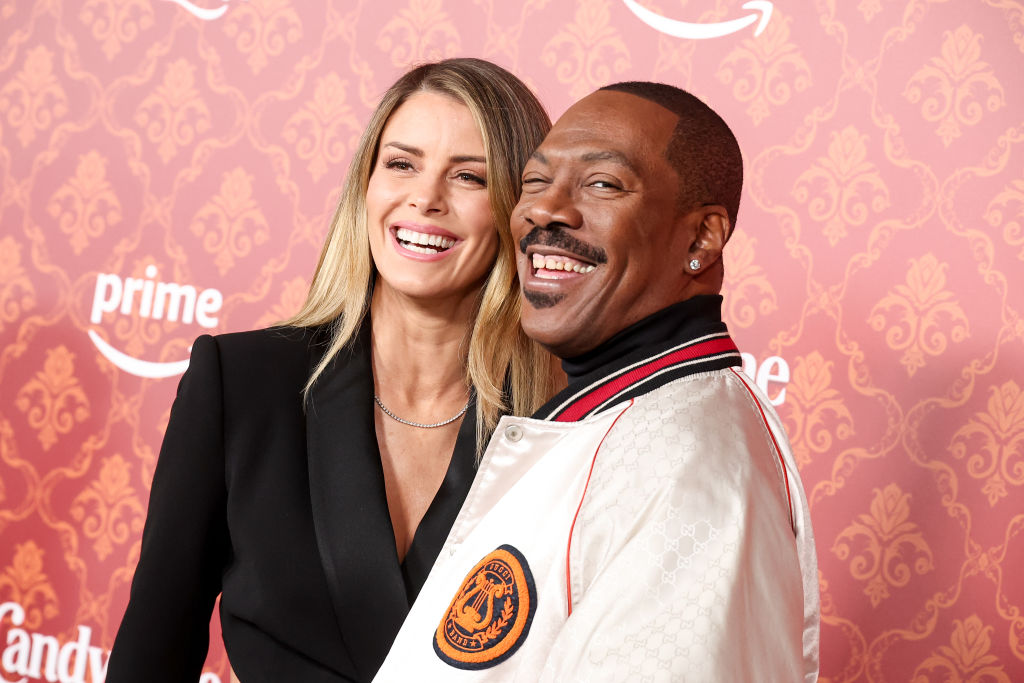 Eddie Murphy and Paige Butcher attend "Candy Cane Lane" Premiere - Arrivals