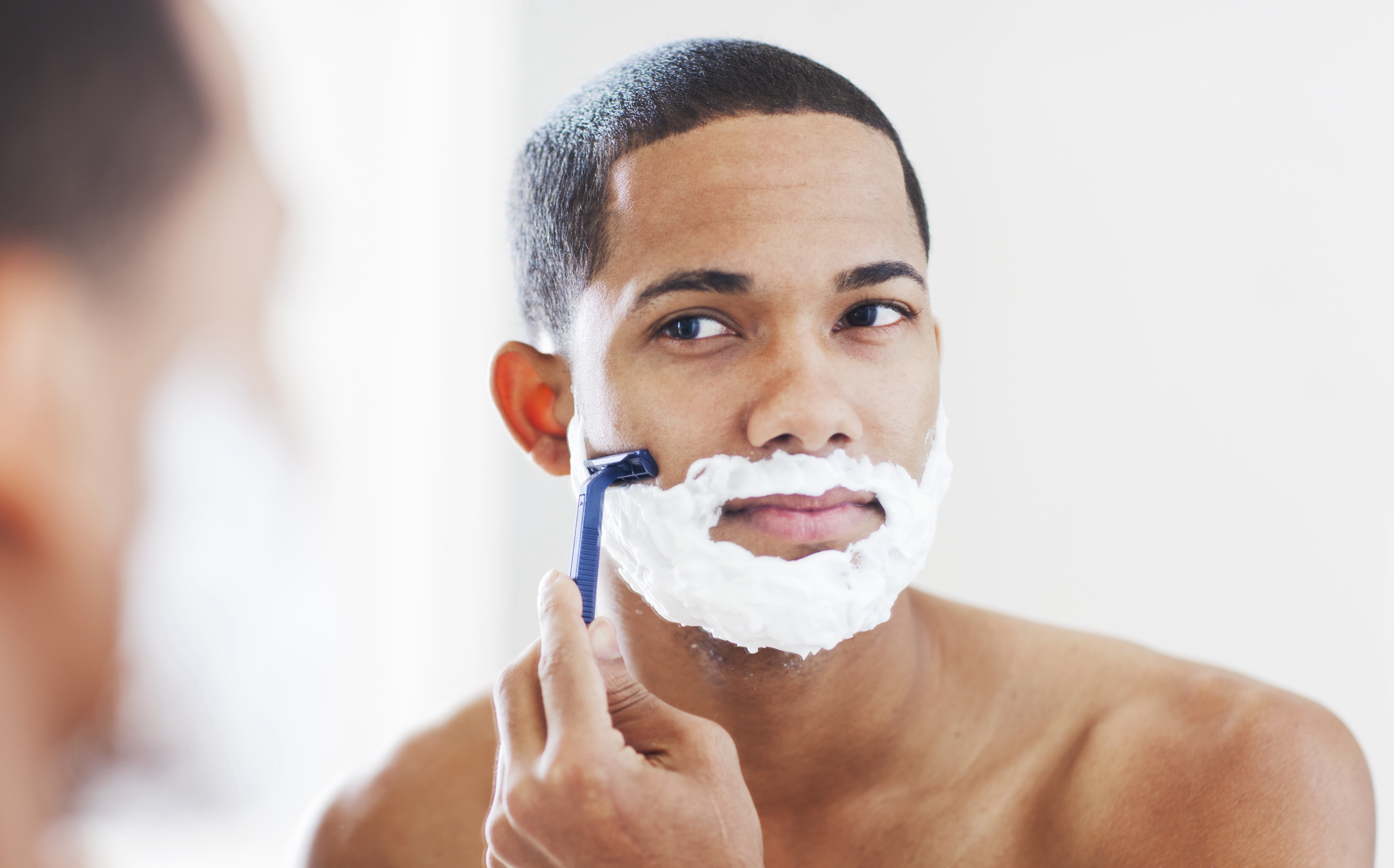 Black man shaving image