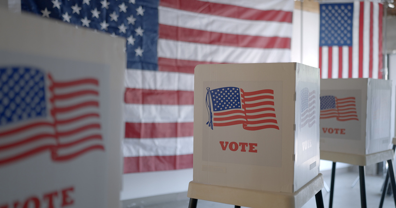 Wide view, row of voting booths at polling station in United States