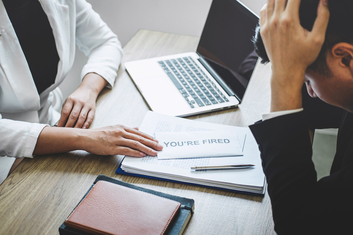 Manager Firing Businessman In Office