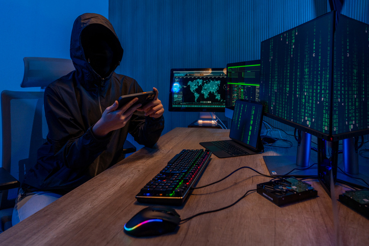 young professional female hacker using keyboard typing bad data into computer online system and spreading to global stolen personal information.