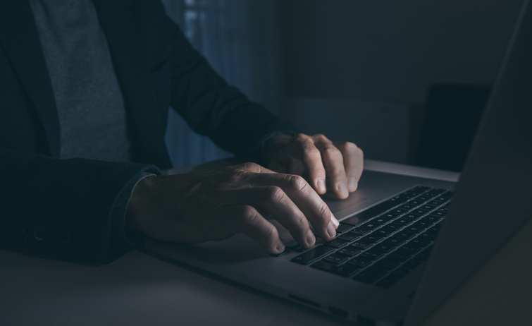 Hands Typing On Laptop Keyboard. Man Working On Computer. Dark Mood. Technology, Business Concept