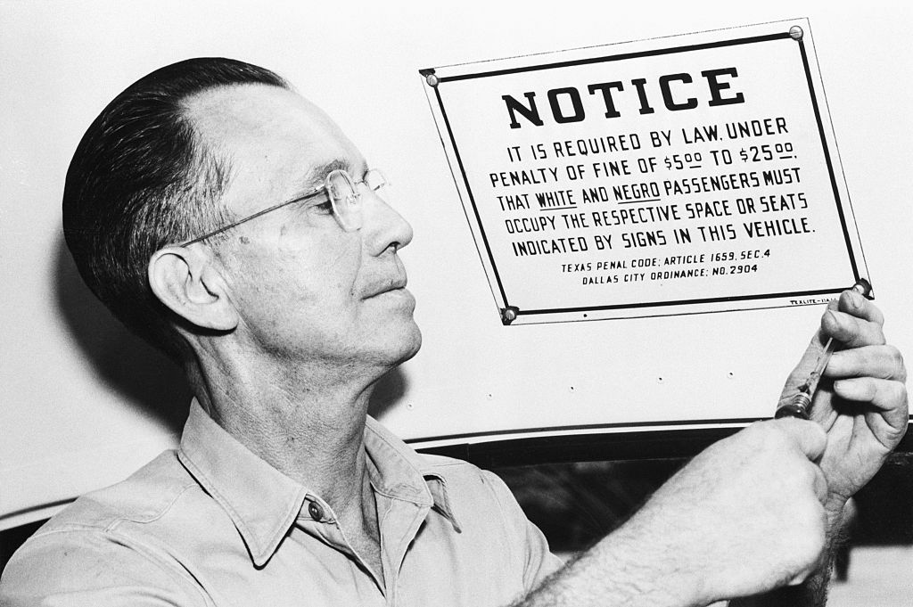 Noble Bradford Removes Segregation Sign