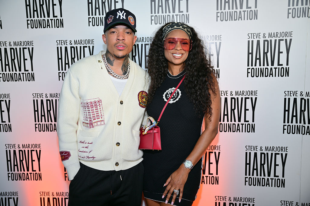 Christian Gold and Jennifer Williams attend The Steve & Marjorie Harvey Foundation Presents: Celebrity Topgolf